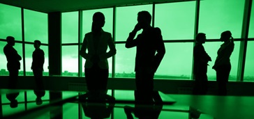 office worker silhouettes, green tint