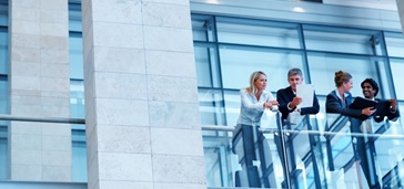 Business people talking on a balcony